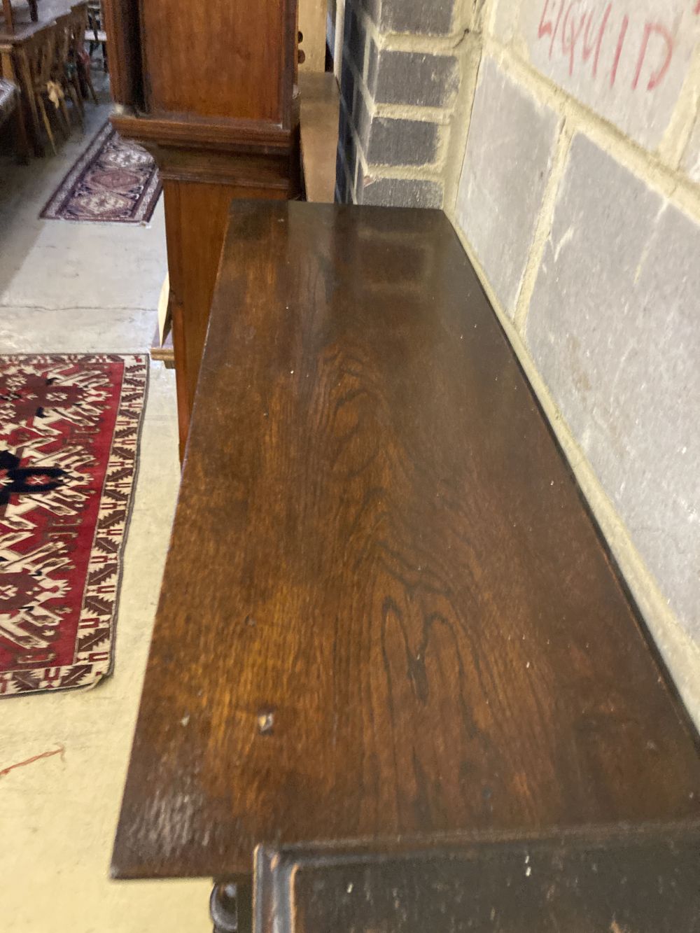 A 1920s oak two door glazed bookcase, width 92cm depth 30cm height 140cm